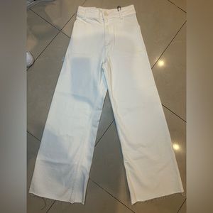 White wide legged, high rise jeans. Brand new with tags still attached.